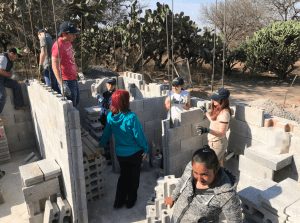 Momentum Factor employees help build home in Mexico for local family